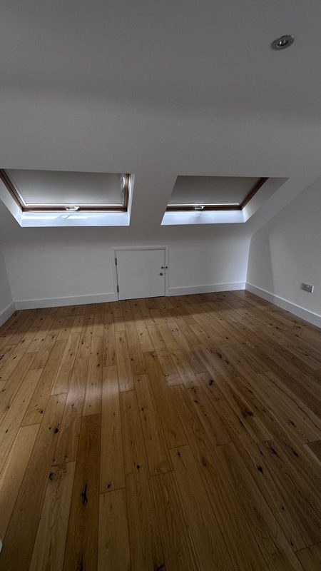 The loft room under two skylights, before the work.