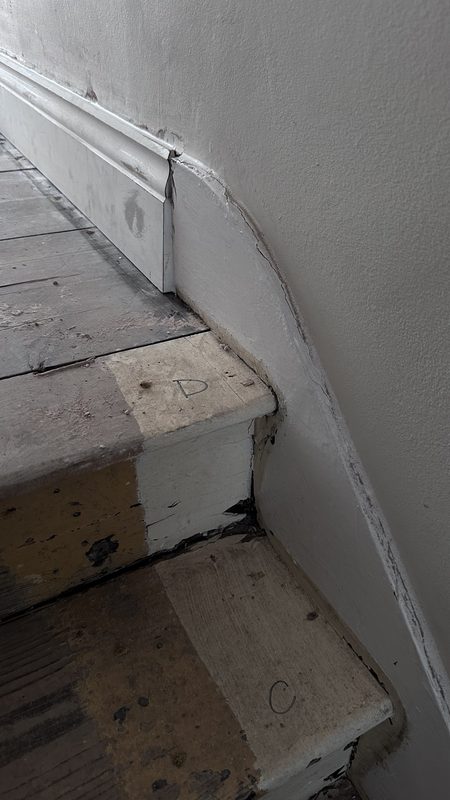 The stair stripped back during the work.