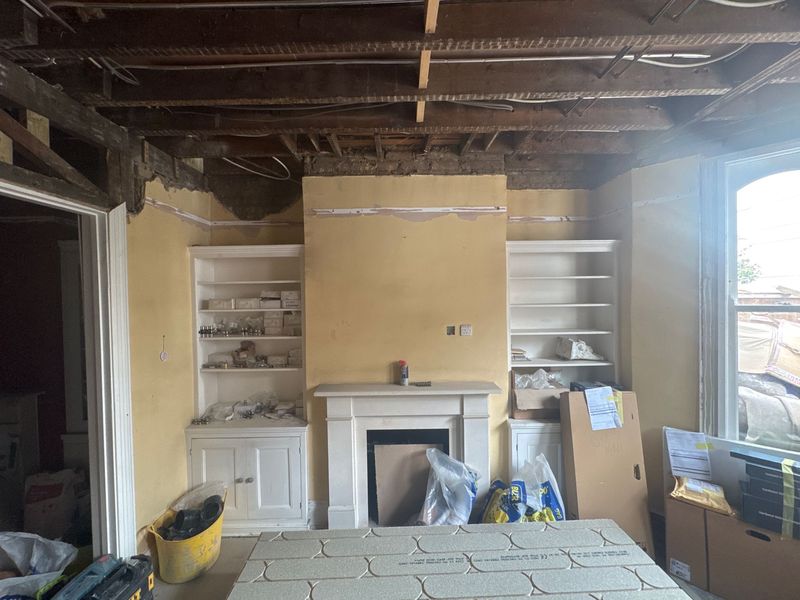 The reception room with the ceiling down to the joists
