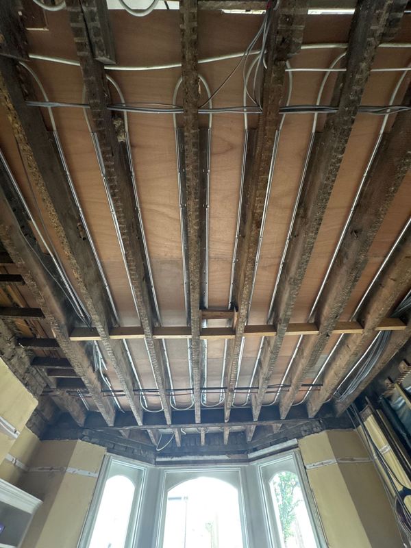 The ceiling opened to the joists above the bay
