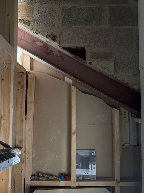 A steel and new stud walls on the stair