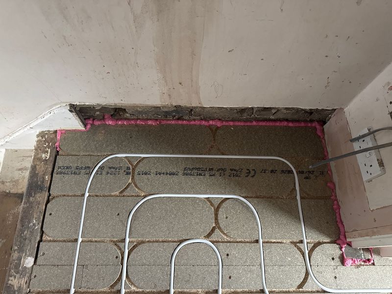 Underfloor heating loops in a doorway