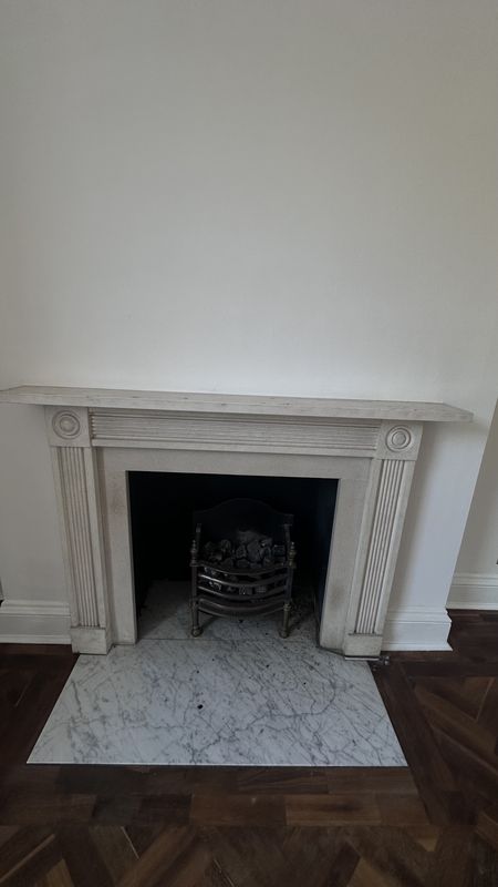 A fireplace in the drawing room, before the work