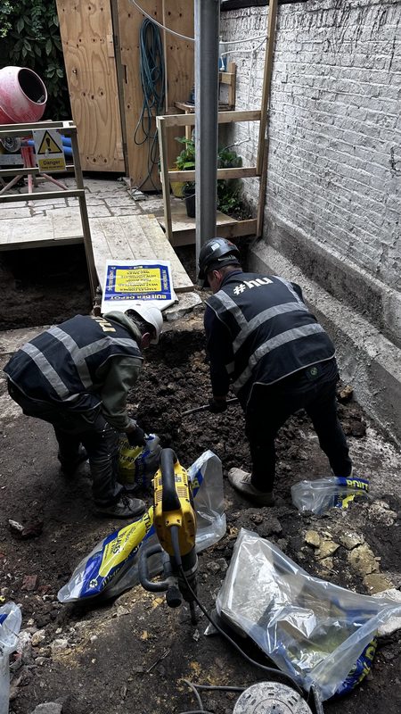Our team digging out at the back of the house.