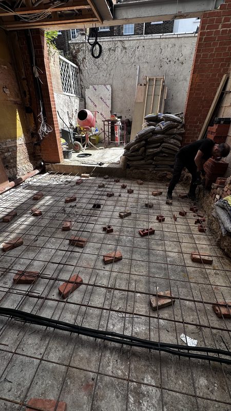 Steel mesh laid for the new floor slab in the side return.