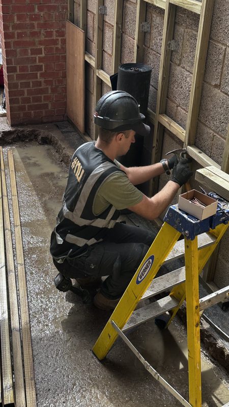 One of our team fixing timber studwork in the side return.