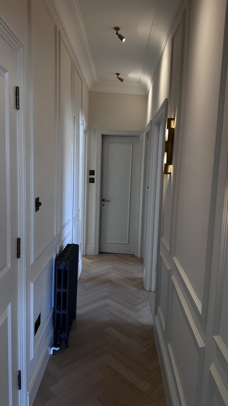 The finished corridor, panelled walls and herringbone oak.