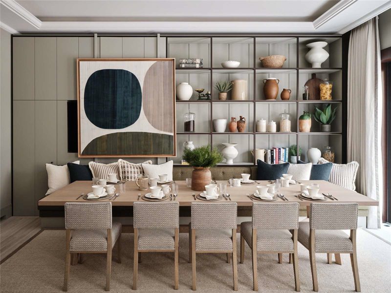 Breakfast room with green shelving and a framed artwork panel.
