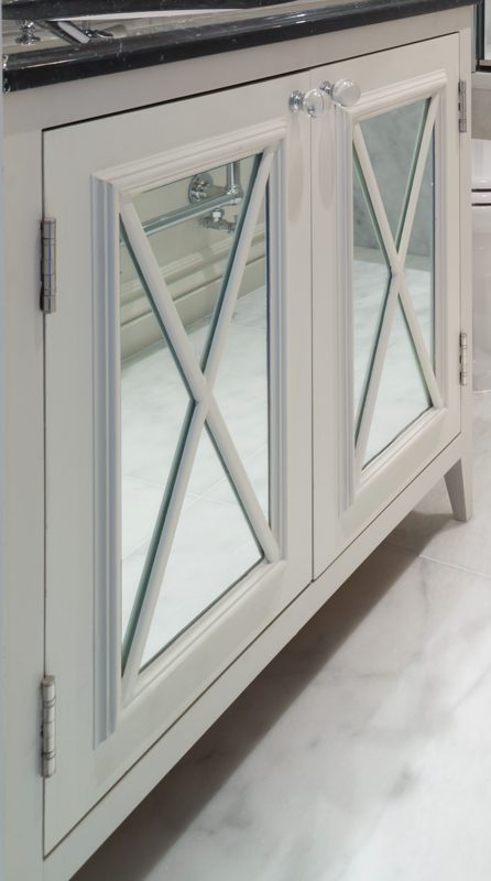 Vanity cupboard with mirrored doors and glazing bar detail.
